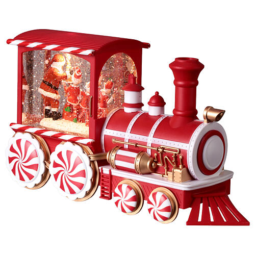 Locomotiva con neve caramelle musica e luci 30x10x15 cm 5