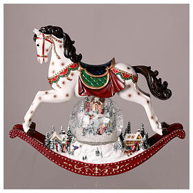 Rocking horse with snow globe and village, 12x5x12 in
