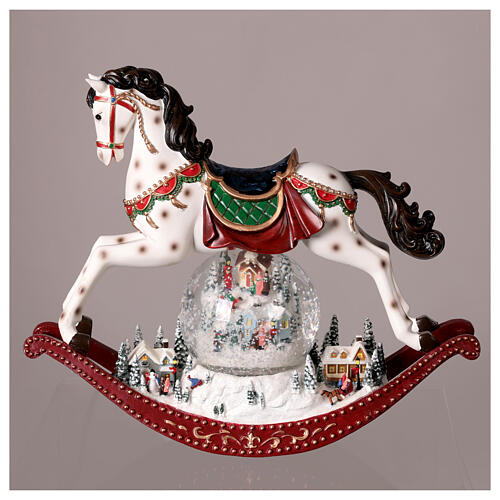 Rocking horse snow globe and village, 30x12x30 cm 2