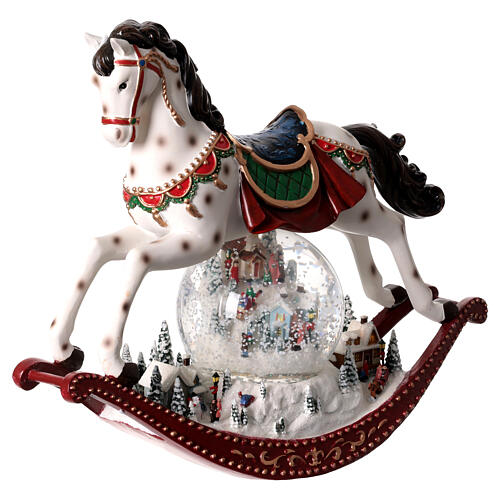 Rocking horse snow globe and village, 30x12x30 cm 3