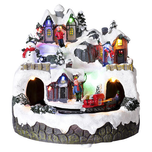 Pueblo navideño iluminado tren en movimiento música batería 20x20 cm 1