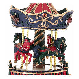 Carrousel boîte à musique rouge et bleu en résine 15x10 cm