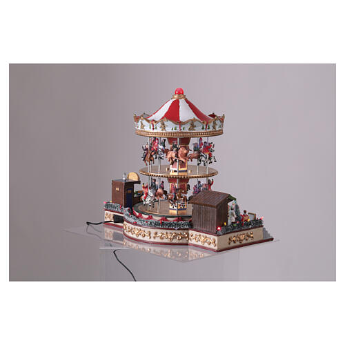 Pueblo navideño carrusel dos pisos animales y música 35x40x30 cm 4