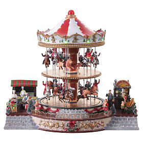 Village de Noël carrousel deux étages animaux et musique 35x40x30 cm