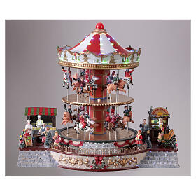 Village de Noël carrousel deux étages animaux et musique 35x40x30 cm
