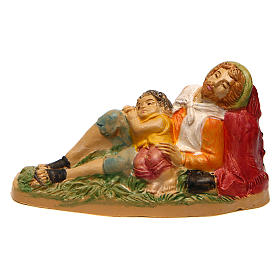 Uomo sdraiato con bambino di 10 cm presepe