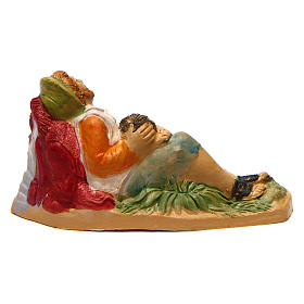 Uomo sdraiato con bambino di 10 cm presepe
