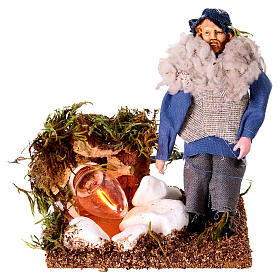 Shepherd at a fire with lights terracotta and plastic, 12 cm nativity