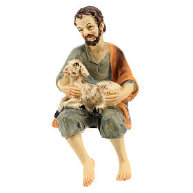 Pastor sentado com ovelha no joelho para presépio com figuras de resina de 12 cm de altura média