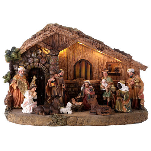 Resin stable with Nativity Scene of 10 cm, music and light, 25x35x15 cm 1
