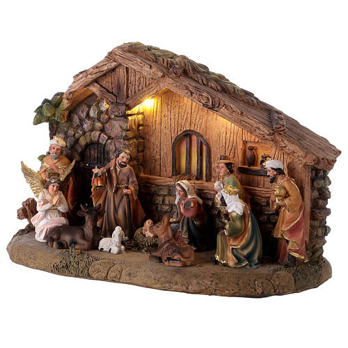 Resin stable with Nativity Scene of 10 cm, music and light, 25x35x15 cm 3