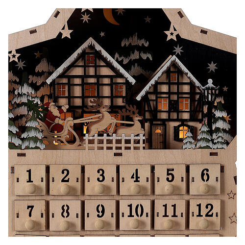 Wooden Advent calendar, star-shaped, with lights and music box, 40x40x10 cm 3