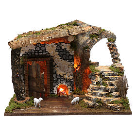 Cabaña con fuego y cabritas, dimensiones 40x50x30 cm