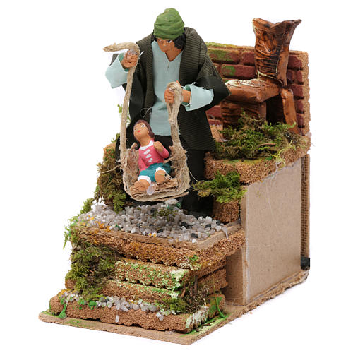 Moving figurine for Nativity scene, shepherd with child 10 cm 2