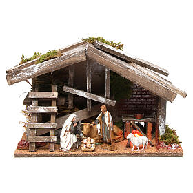 Holzhütte mit Heiligen Familie und Feuer 25x35x15cm