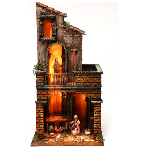 Illuminated house with square base with Neapolitan nativity figurines 1