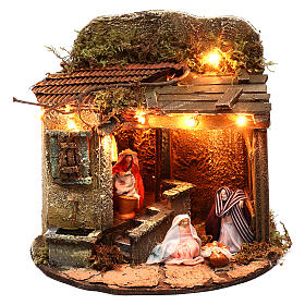 Illuminated village on a round base with Holy Family, 15x20 cm Neapolitan nativity