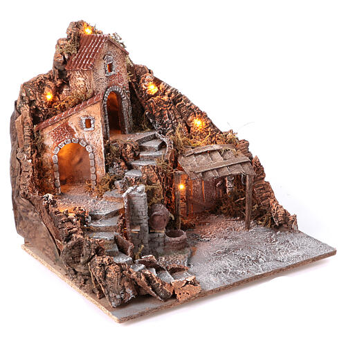 Nativity village with central fountain, left staircase 40x45x45 lighted 6-8-10 cm 3