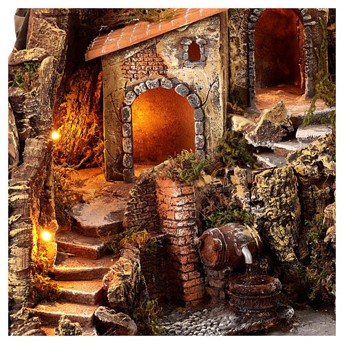 Nativity village with central fountain, left staircase 40x45x45 lighted 6-8-10 cm 2