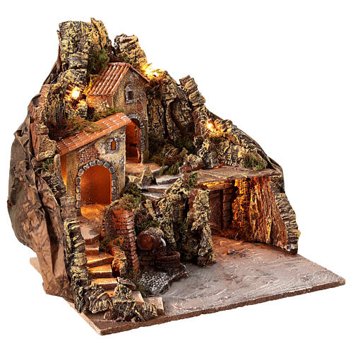 Nativity village with central fountain, left staircase 40x45x45 lighted 6-8-10 cm 4