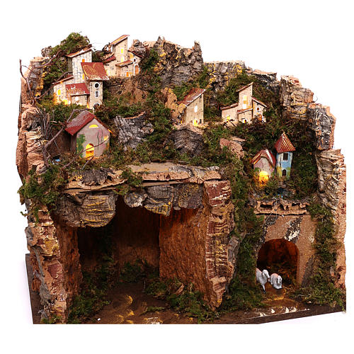 Illuminated village on mountain with cave and hayloft Nativity scene 9 cm 3
