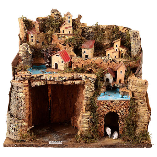 Borgo illuminato su montagna con grotta e fienile presepe 9 cm 1