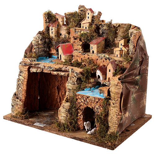 Borgo illuminato su montagna con grotta e fienile presepe 9 cm 2