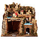Borgo illuminato su montagna con grotta e fienile presepe 9 cm s1