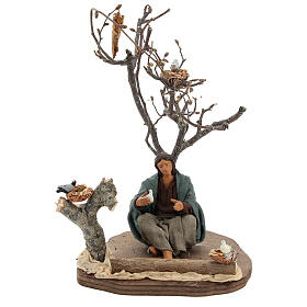 Miniature woman sitting under tree with birds, 14 cm nativity