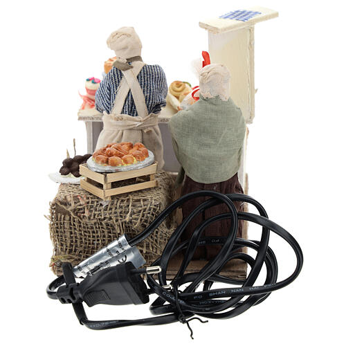 Cukiernik z ladą pełną słodyczy, ruch, wys. referencyjna 13 cm 5