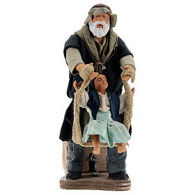 Mężczyzna bawiący się z dziewczynką ruchoma figurka do szopki z Neapolu 14 cm