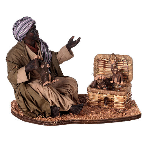 Moor man sitting with monkeys for Neapolitan Nativity Scene with characters of 30 cm 1