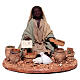 Moorish shepherdess sitting on the ground with seeds for Neapolitan nativity scene 13 cm s1