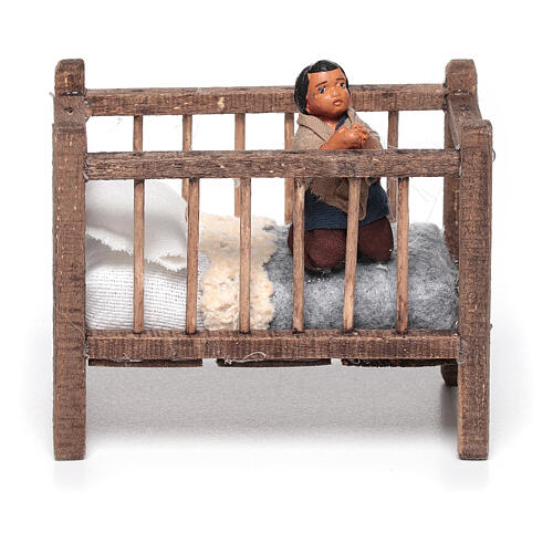 Boy praying in crib for 10 cm Neapolitan nativity terracotta 1