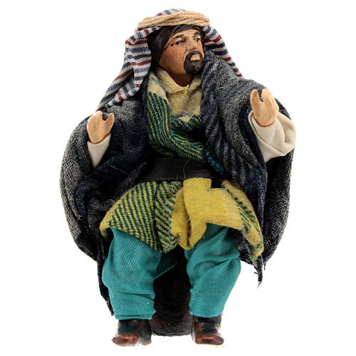 Old Arabic man sitting on a stone, figurine for Neapolitan Nativity Scene with 12 cm characters 1