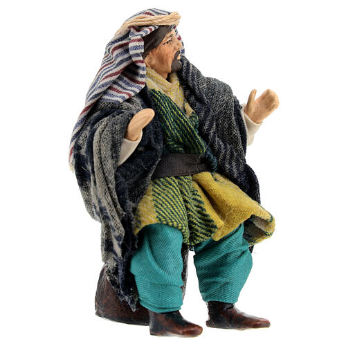 Old Arabic man sitting on a stone, figurine for Neapolitan Nativity Scene with 12 cm characters 3