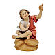 Child sitting at the bonfire Original Pastore Nativity Scene in painted wood from Valgardena 12 cm s1