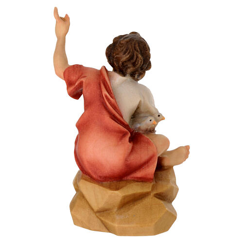 Enfant assis sur rocher pour crèche Original Berger bois peint Val Gardena de 12 cm 4