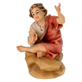 Bambino seduto al falò presepe Original Pastore legno dipinto in Val Gardena 12 cm