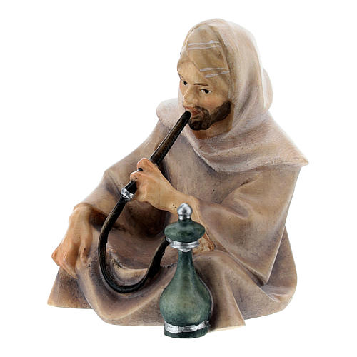Sitting shepherd with water pipe Original Cometa Nativity Scene in painted wood from Valgardena 10 cm 2