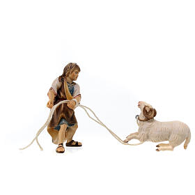 Child pulling a kneeling ram Original model painted wood from Val Gardena 10 cm