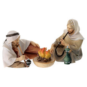 Shepherds smoking around fire 12 cm, nativity Original Comet, in painted Val Gardena wood