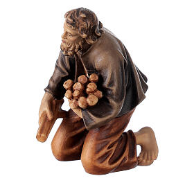 Man kneeled at campfire in painted wood, Kostner Nativity scene 12 cm