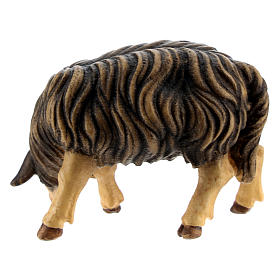 Owca czarna jedząca drewno malowane szopka Kostner 12 cm
