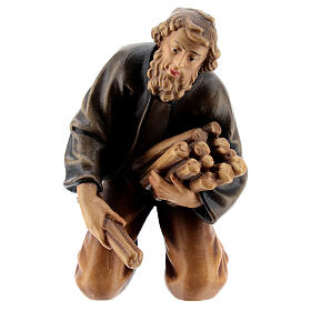 Shepherd adding firewood 11 cm, nativity Rainell, in painted wood