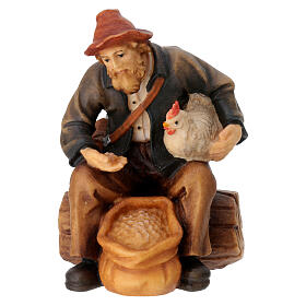 Sitting shepherd with grains in painted wood for 9 cm Rainell Nativity scene, Val Gardena