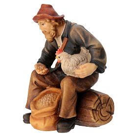 Sitting shepherd with grains in painted wood for 9 cm Rainell Nativity scene, Val Gardena