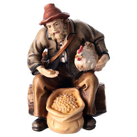 Sitting shepherd with grains in painted wood for 11 cm Rainell Nativity scene, Val Gardena