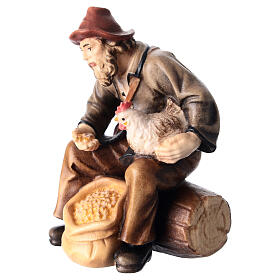 Sitting shepherd with grains in painted wood for 11 cm Rainell Nativity scene, Val Gardena