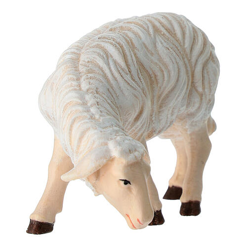Eating sheep looking to its left in painted wood from Valgardena for Rainell Nativity Scene 11 cm 2